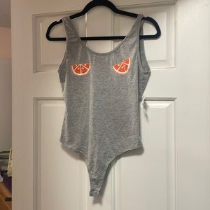 Low back grey body suit with orange slices on chest. Medium NWT